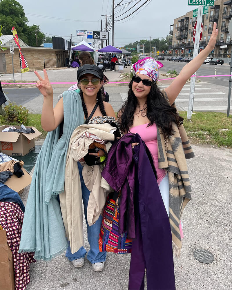 customers holding clothes