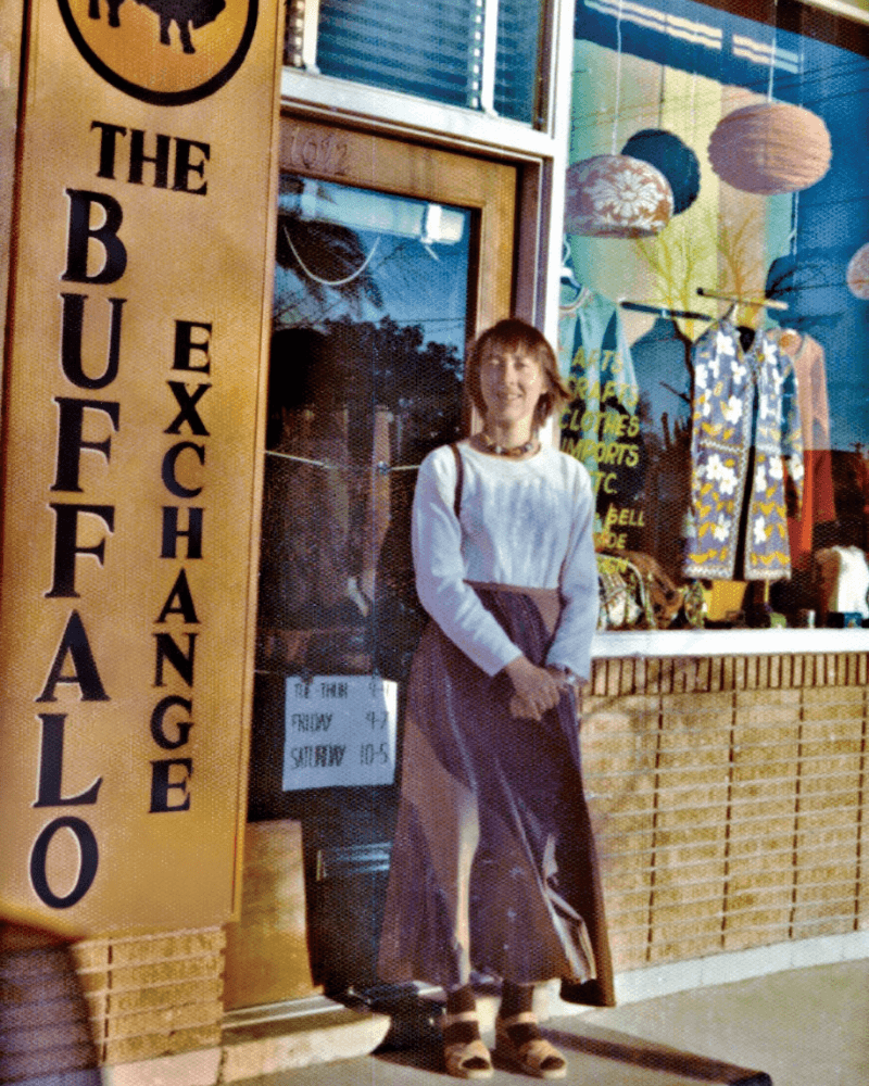 Vintage photo of Kerstin Block standing out front of the original Buffalo Exchange store